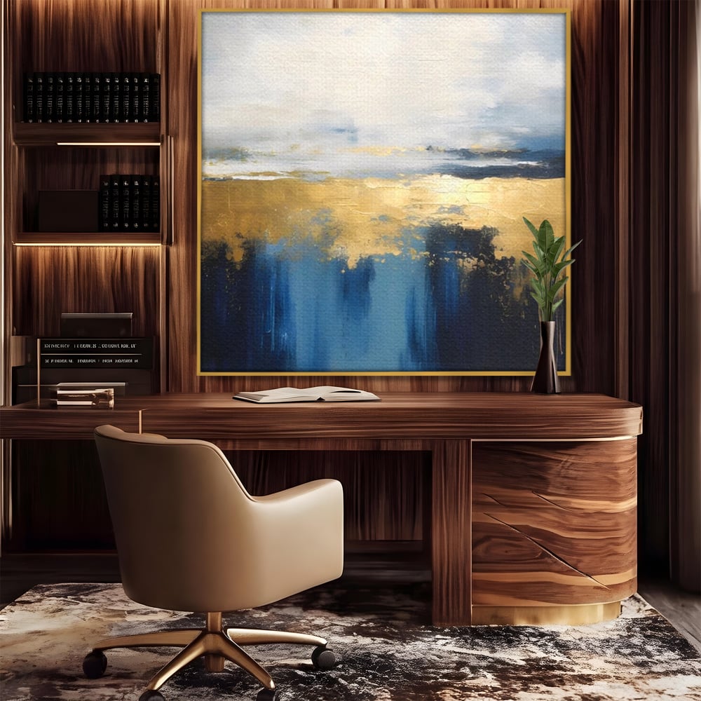 Tablou canvas cu pictura abstracta cu tonuri aurii si albastre, in rama de aluminiu auriu, pe perete intr-un birou